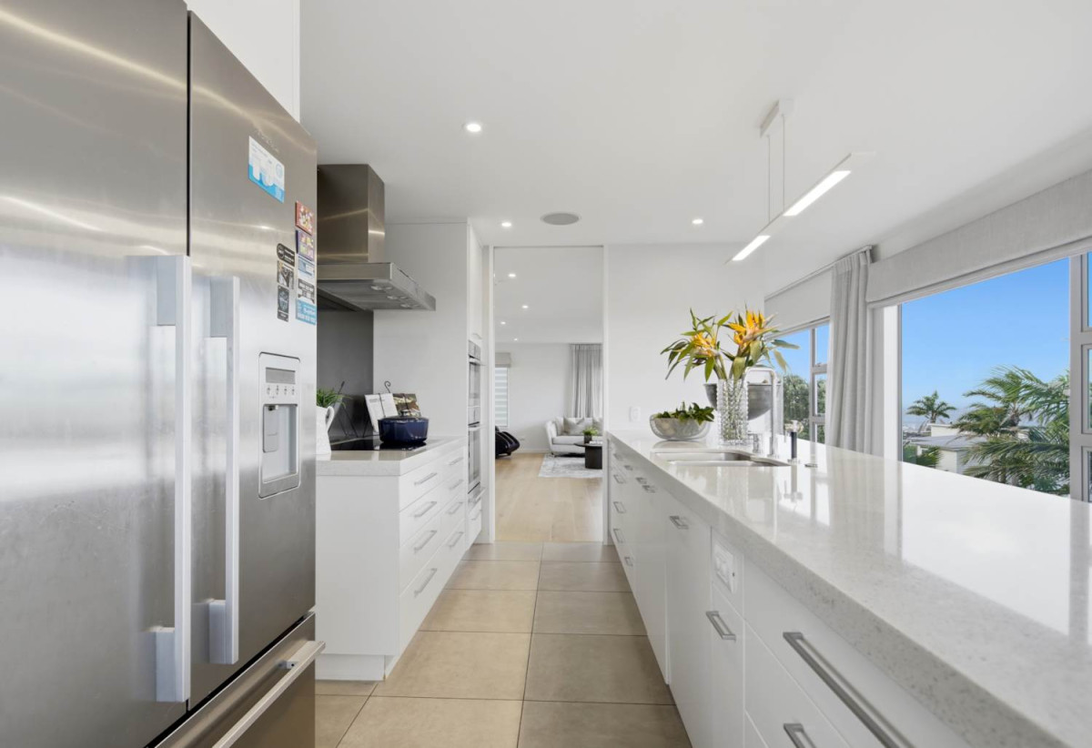 Double Westlake school zone, Breathtaking 180° Views, Sea Views, city skyline views, 640m2 section, 4 beds (2 ensuites) + large office room and rumpus room 3.5 baths house with double garage, 2024 luxury renovated, close to beach, Milford shops, schools, Zoned for Campbells Bay School, Westlake Boys’ and Westlake Girls’ High Schools, and Murrays Bay Intermediate, 62 Seaview Road, Castor Bay, Auckland