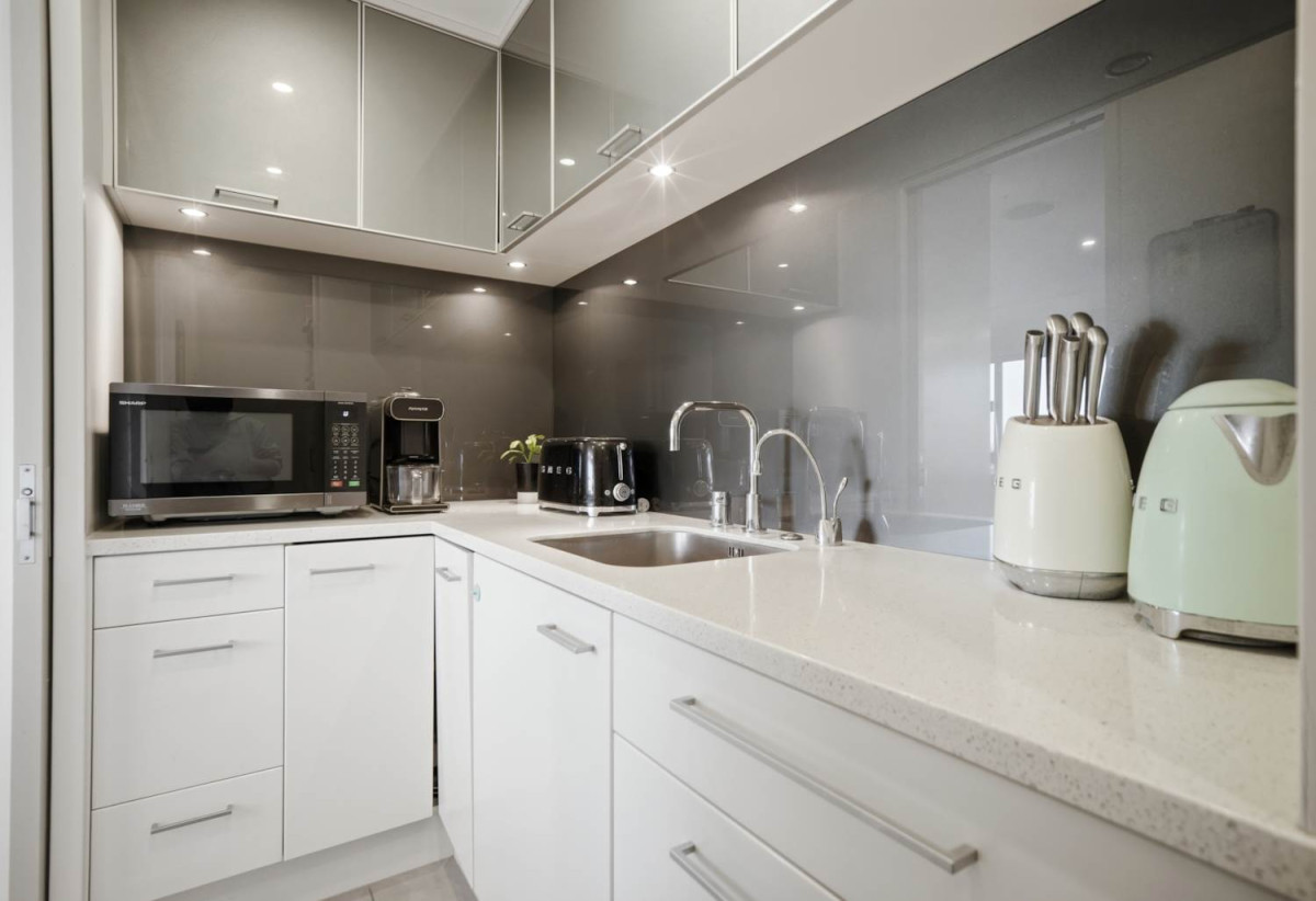 Double Westlake school zone, Breathtaking 180° Views, Sea Views, city skyline views, 640m2 section, 4 beds (2 ensuites) + large office room and rumpus room 3.5 baths house with double garage, 2024 luxury renovated, close to beach, Milford shops, schools, Zoned for Campbells Bay School, Westlake Boys’ and Westlake Girls’ High Schools, and Murrays Bay Intermediate, 62 Seaview Road, Castor Bay, Auckland