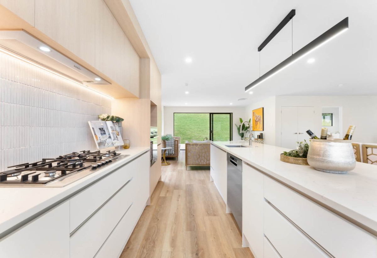 587m2 section, 227m2 Brandnew standalone 5 beds (1 ensuite) 3 baths house with double garage and big backyard, 3 beds 1 bath ground floor, move-in ready, close to schools, shops, beach, motorway access, 0.5 km to Nukumea School, 2 km to Orewa College, 242E West Hoe Heights, Orewa, Auckland