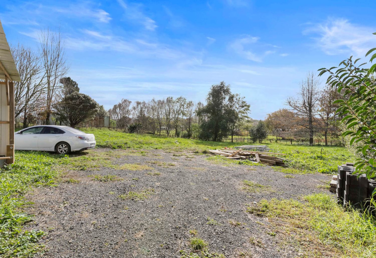 3008m2 section, Nearby Pokeno town centre and Woolworths supermarket, 2 beds 1 bath house with standalone garage, plus a separate sleepout with two rooms, close to motorway access, Zoned Medium Density Residential, with potential for subdivision (subject to council approval), 15A Selby Street, Pokeno