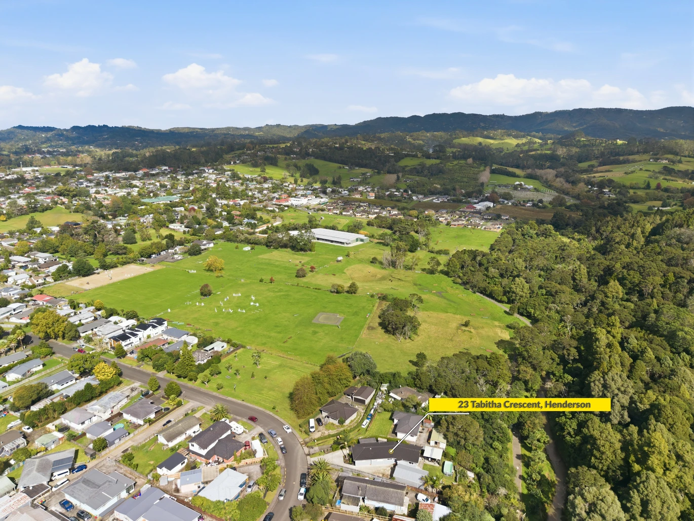 909m2 section, 158m2 4 beds 2 baths main houe PLUS a separate wing/sleepout with a 5th bedroom, bathroom, and covered deck, a massive covered patio with a professional-grade wood-fired pizza oven and a fully equipped outdoor bar area, a large carport, close to reserves, local shops, schools, 23 Tabitha Crescent Henderson, Auckland