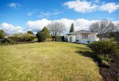 The owners are ready for a bigger home. 130m2 Brick and tile 2 beds 1 bath home with garage, 2/219 Edmonton Road, Te Atatu South, Auckland
