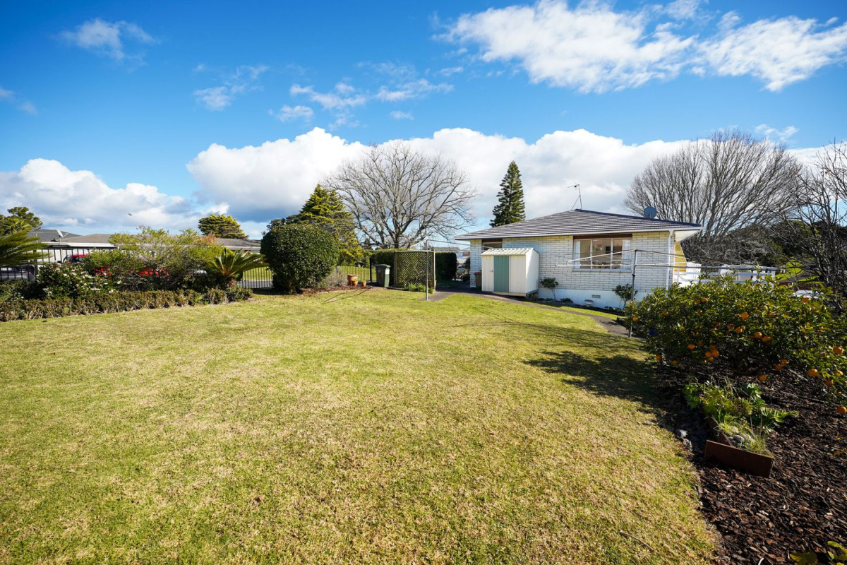 The owners are ready for a bigger home. 130m2 Brick and tile 2 beds 1 bath home with garage, 2/219 Edmonton Road, Te Atatu South, Auckland