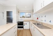 The owners are ready for a bigger home. 130m2 Brick and tile 2 beds 1 bath home with garage, 2/219 Edmonton Road, Te Atatu South, Auckland