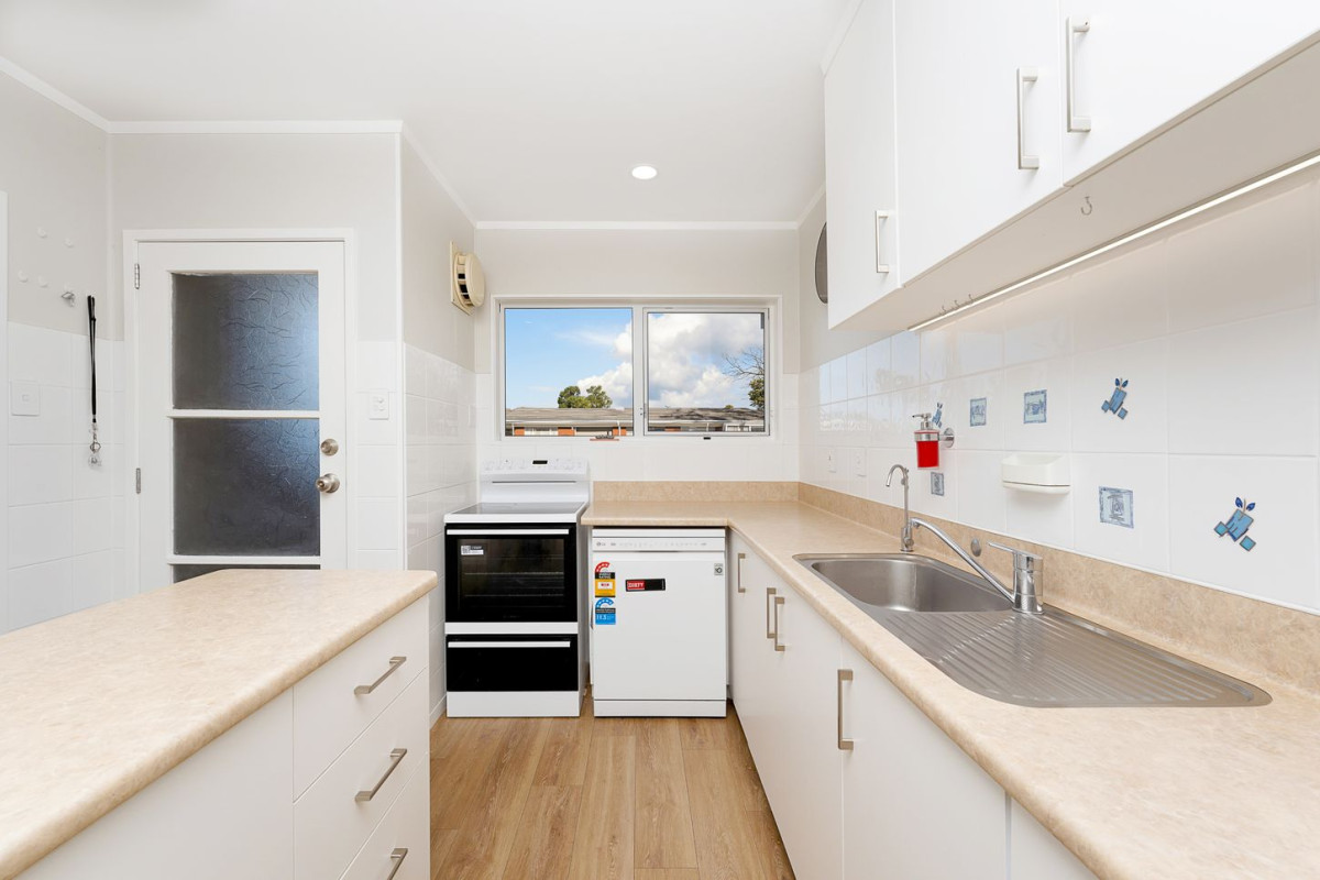 The owners are ready for a bigger home. 130m2 Brick and tile 2 beds 1 bath home with garage, 2/219 Edmonton Road, Te Atatu South, Auckland