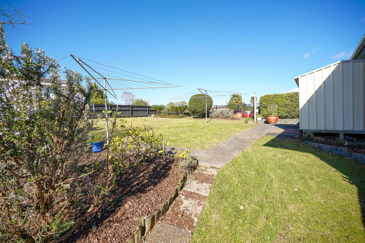 The owners are ready for a bigger home. 130m2 Brick and tile 2 beds 1 bath home with garage, 2/219 Edmonton Road, Te Atatu South, Auckland