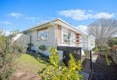 The owners are ready for a bigger home. 130m2 Brick and tile 2 beds 1 bath home with garage, 2/219 Edmonton Road, Te Atatu South, Auckland