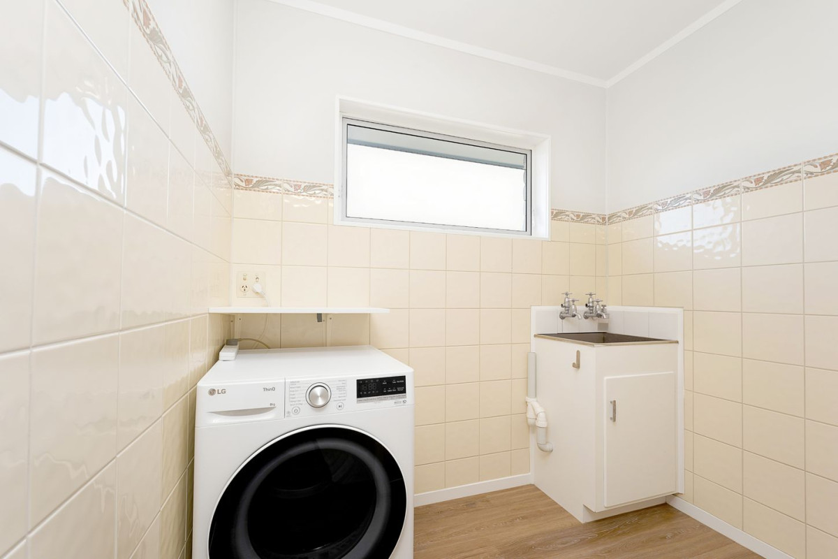 The owners are ready for a bigger home. 130m2 Brick and tile 2 beds 1 bath home with garage, 2/219 Edmonton Road, Te Atatu South, Auckland
