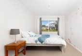 The owners are ready for a bigger home. 130m2 Brick and tile 2 beds 1 bath home with garage, 2/219 Edmonton Road, Te Atatu South, Auckland