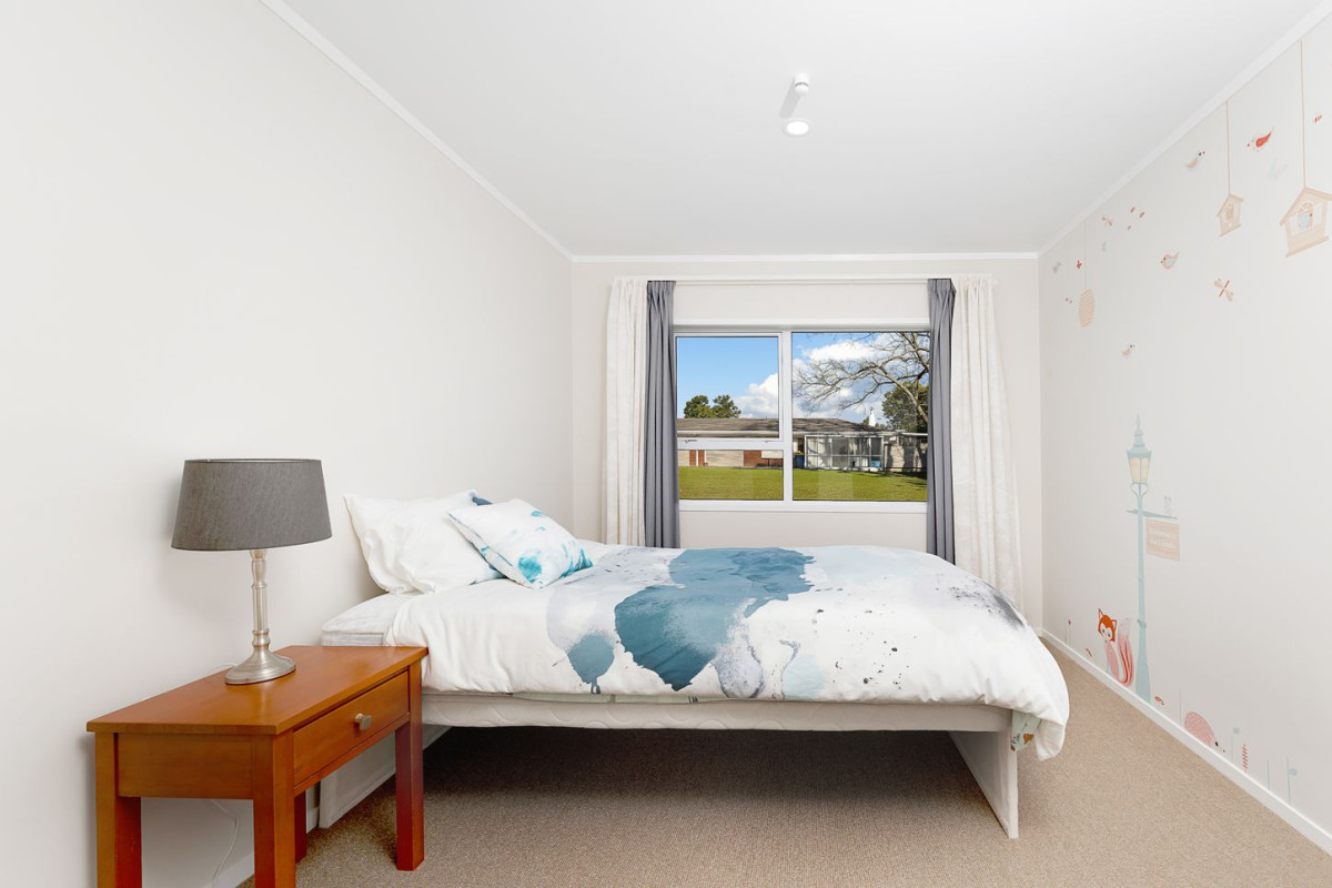 The owners are ready for a bigger home. 130m2 Brick and tile 2 beds 1 bath home with garage, 2/219 Edmonton Road, Te Atatu South, Auckland