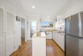 The owners are ready for a bigger home. 130m2 Brick and tile 2 beds 1 bath home with garage, 2/219 Edmonton Road, Te Atatu South, Auckland