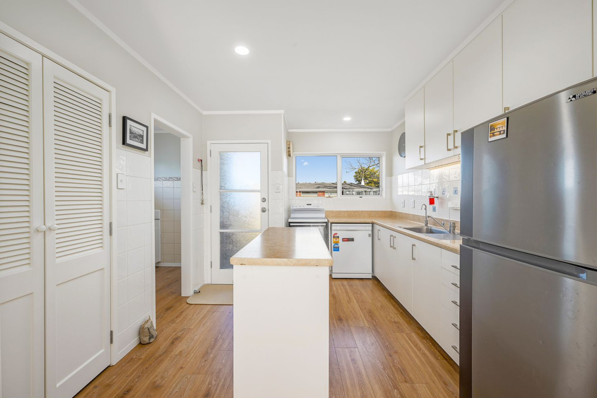 The owners are ready for a bigger home. 130m2 Brick and tile 2 beds 1 bath home with garage, 2/219 Edmonton Road, Te Atatu South, Auckland