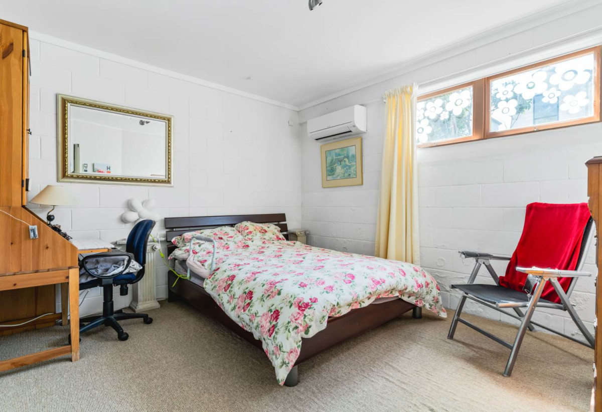 Robust construction – Concrete block and brick, 3 beds + Flexi room 2 baths home, Upstairs: 2 beds 1 bath, Separate living room with access to a sunny porch, Open-plan kitchen and dining area, Downstairs: Additional bedroom plus living area, Bathroom and utility room, 2/2B Yeoman Place, Howick, Auckland