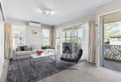 Robust construction – Concrete block and brick, 3 beds + Flexi room 2 baths home, Upstairs: 2 beds 1 bath, Separate living room with access to a sunny porch, Open-plan kitchen and dining area, Downstairs: Additional bedroom plus living area, Bathroom and utility room, 2/2B Yeoman Place, Howick, Auckland