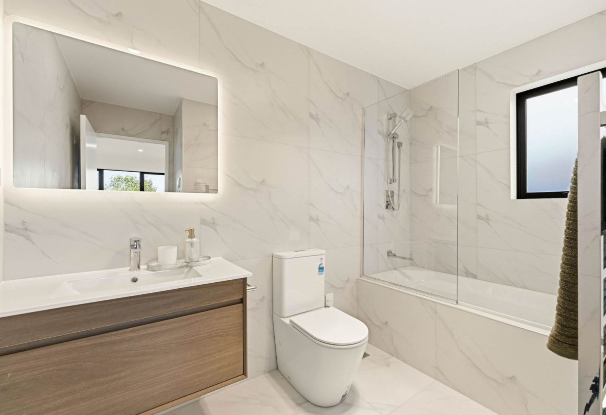 Brandnew 5 beds 3.5 baths home with garage, The ground floor is a revelation: two private bedroom suites share a combined bathroom and have a separate entrance, 29 Scott Road, Hobsonville, Auckland