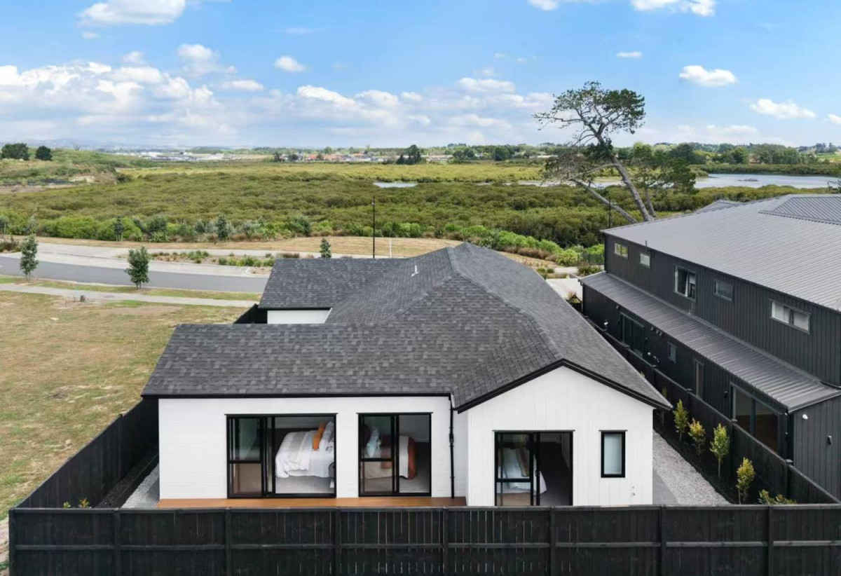 With views across a peaceful bush reserve, 5 beds (2 ensuites) 3 baths house with double garage, Crafted from premium James Hardie and brick, 51 Emerald Avenue, Karaka, Auckland