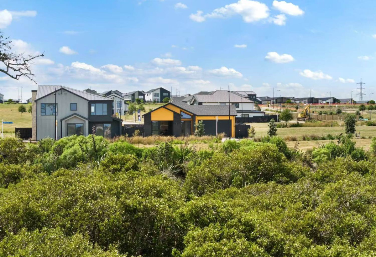 With views across a peaceful bush reserve, 5 beds (2 ensuites) 3 baths house with double garage, Crafted from premium James Hardie and brick, 51 Emerald Avenue, Karaka, Auckland