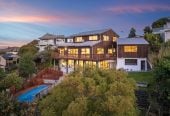 1030m2 section, Elegant Living, Sea Views & Rangitoto Zones, 6 beds (1 ensuite) + study 3.5 baths house with garage and swimming pool, A supersized entertaining lounge on the lower level, along with its own bathroom and two generous bedrooms, provides exceptional flexibility. 32 Bellbird Rise, Murrays Bay, Auckland