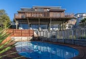 1030m2 section, Elegant Living, Sea Views & Rangitoto Zones, 6 beds (1 ensuite) + study 3.5 baths house with garage and swimming pool, A supersized entertaining lounge on the lower level, along with its own bathroom and two generous bedrooms, provides exceptional flexibility. 32 Bellbird Rise, Murrays Bay, Auckland