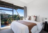 1030m2 section, Elegant Living, Sea Views & Rangitoto Zones, 6 beds (1 ensuite) + study 3.5 baths house with garage and swimming pool, A supersized entertaining lounge on the lower level, along with its own bathroom and two generous bedrooms, provides exceptional flexibility. 32 Bellbird Rise, Murrays Bay, Auckland