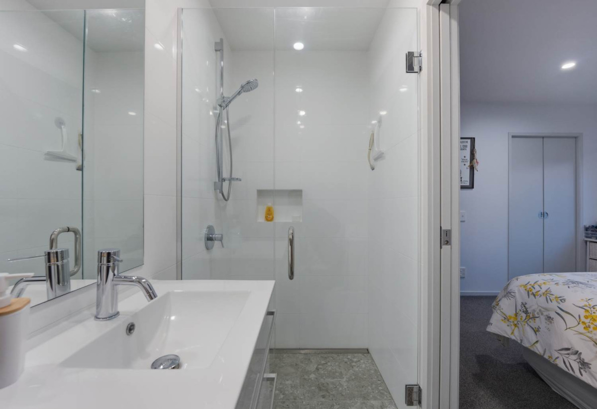 Once in 14 years, Must Sell – Vendors Moving to Retirement Village, Botany Downs Secondary College zone, 2 beds (2 ensuites) 2.5 baths home with single garage and 1 car park, Enjoy exclusive resident access to a swimming pool, tennis court and gym at no extra cost, Short walk to the mall and Botany Downs Secondary College, 90/2 Armoy Drive, East Tamaki, Auckland