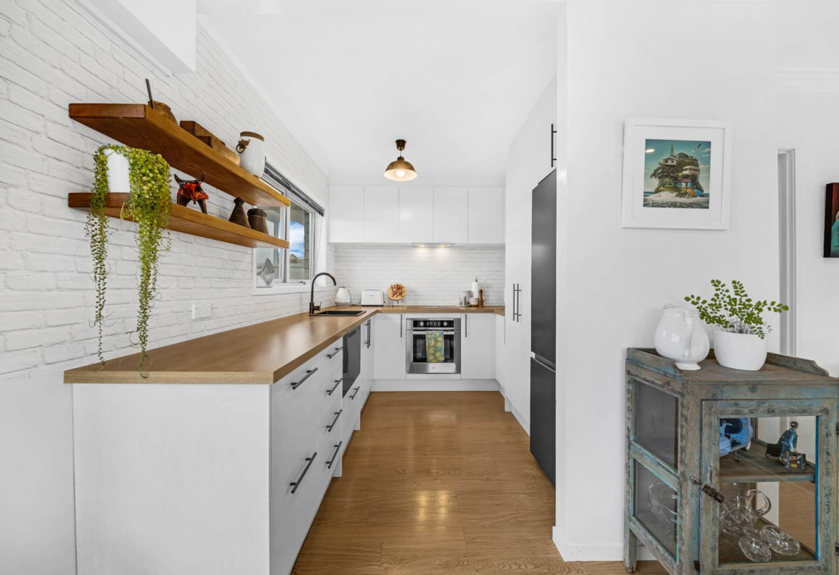 Rangitoto College zone, Brick and tile 2 beds + storage room or Flexi room (3.13 x 2.05M) 1 bath house with garage, 2/4 Noumea Place, Mairangi Bay, Auckland