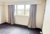 MORTGAGEE SALE, 949m2 section, Positioned next door to Stanmore Bay School, Previously consented and operated as an educational training facility for a number of years, the layout comprises multiple office spaces, a large open-plan area, kitchen facilities and two separate toilets, 32 Waiora Road, Stanmore Bay, Auckland