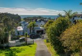 1322m2 section with Sea Views, Double Westlake school zone, Brick and tile 4 beds 3 baths house with double garage, Lower Level: Second living area, large fourth bedroom, additional bathroom, and a pool for relaxation. 24 Prospect Terrace, Milford, Auckland