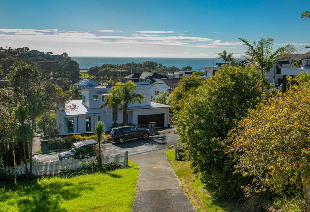 1322m2 section with Sea Views, Double Westlake school zone, Brick and tile 4 beds 3 baths house with double garage, Lower Level: Second living area, large fourth bedroom, additional bathroom, and a pool for relaxation. 24 Prospect Terrace, Milford, Auckland