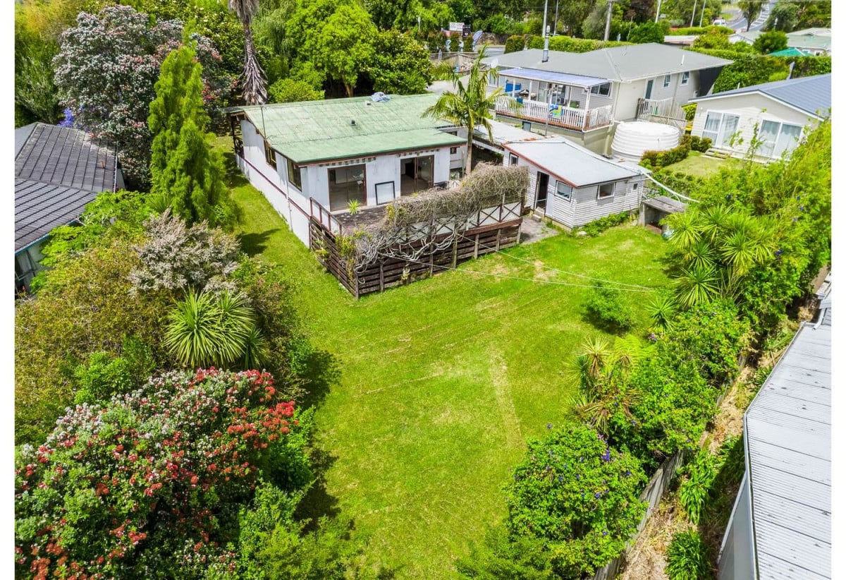 943m2 section, Tenants in place – income from day one, 2 beds 1 bath house with carport, Near beaches, shops, schools, transport, 355 Whangaparaoa Road, Stanmore Bay, Auckland
