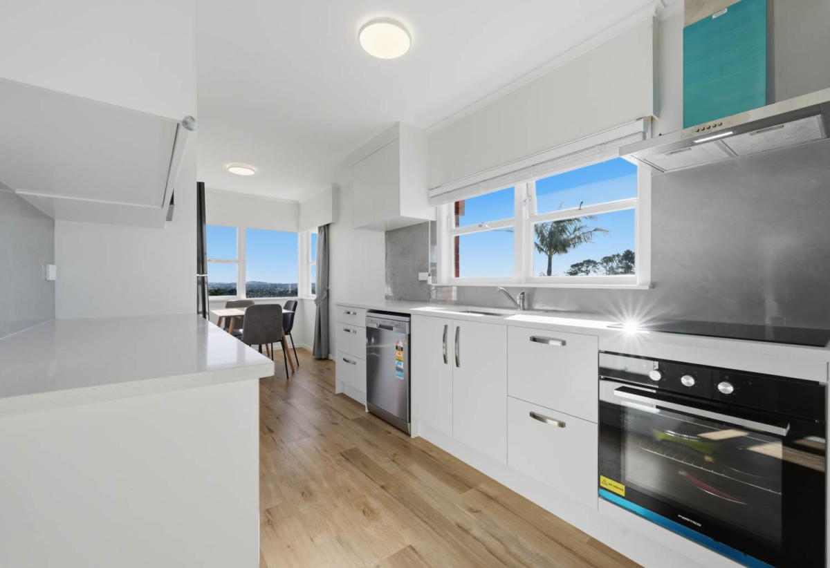 Half of 1130m2 section, Macleans College zone, Sea Views and Sky city views, Brick and tile 3 beds 2 baths house with garage, 1/68 Bleakhouse Road, Bucklands Beach, Auckland