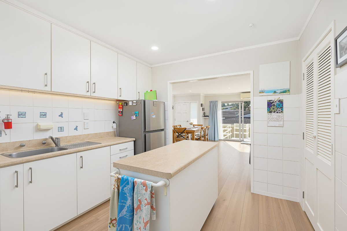 The owners are ready for a bigger home. 130m2 Brick and tile 2 beds 1 bath home with garage, 2/219 Edmonton Road, Te Atatu South, Auckland