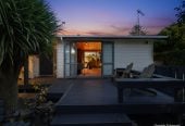 1088m2 section, 3 beds 1 bath house with carport, wooden walls and ceilings wrap around the interconnected lounge, dining area and kitchen. and Outside, the multi-level timber deck, 37A Youngs Road, Papakura, Auckland