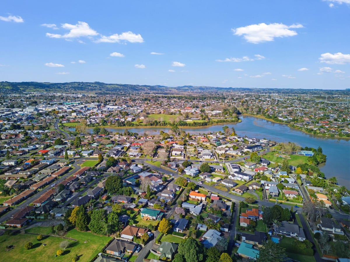 1088m2 section, 3 beds 1 bath house with carport, wooden walls and ceilings wrap around the interconnected lounge, dining area and kitchen. and Outside, the multi-level timber deck, 37A Youngs Road, Papakura, Auckland