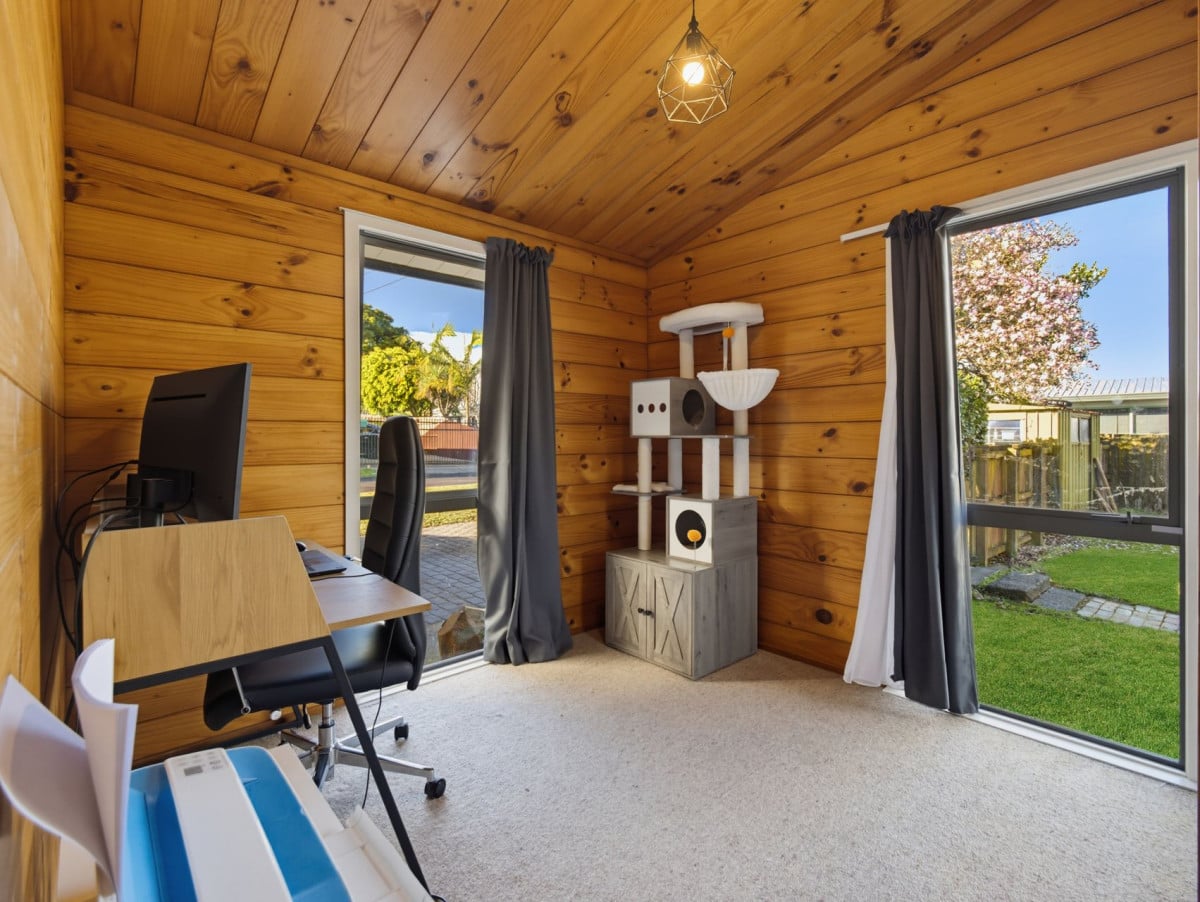 1088m2 section, 3 beds 1 bath house with carport, wooden walls and ceilings wrap around the interconnected lounge, dining area and kitchen. and Outside, the multi-level timber deck, 37A Youngs Road, Papakura, Auckland