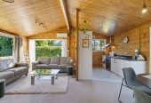 1088m2 section, 3 beds 1 bath house with carport, wooden walls and ceilings wrap around the interconnected lounge, dining area and kitchen. and Outside, the multi-level timber deck, 37A Youngs Road, Papakura, Auckland
