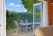 1088m2 section, 3 beds 1 bath house with carport, wooden walls and ceilings wrap around the interconnected lounge, dining area and kitchen. and Outside, the multi-level timber deck, 37A Youngs Road, Papakura, Auckland