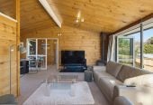 1088m2 section, 3 beds 1 bath house with carport, wooden walls and ceilings wrap around the interconnected lounge, dining area and kitchen. and Outside, the multi-level timber deck, 37A Youngs Road, Papakura, Auckland