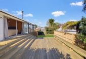 1088m2 section, 3 beds 1 bath house with carport, wooden walls and ceilings wrap around the interconnected lounge, dining area and kitchen. and Outside, the multi-level timber deck, 37A Youngs Road, Papakura, Auckland