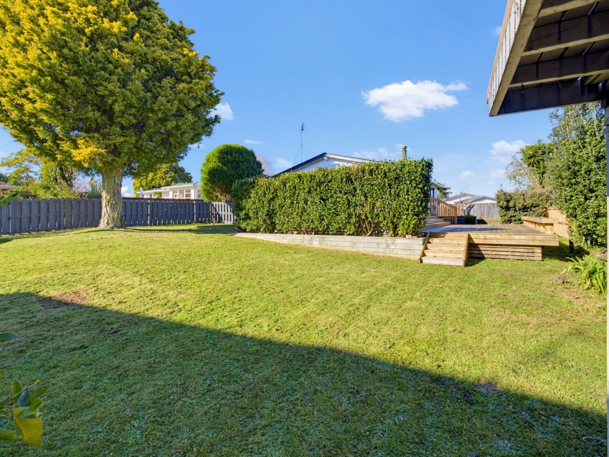 1088m2 section, 3 beds 1 bath house with carport, wooden walls and ceilings wrap around the interconnected lounge, dining area and kitchen. and Outside, the multi-level timber deck, 37A Youngs Road, Papakura, Auckland