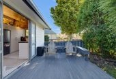 1088m2 section, 3 beds 1 bath house with carport, wooden walls and ceilings wrap around the interconnected lounge, dining area and kitchen. and Outside, the multi-level timber deck, 37A Youngs Road, Papakura, Auckland