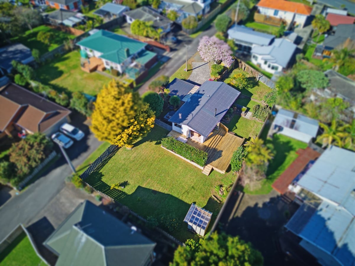 1088m2 section, 3 beds 1 bath house with carport, wooden walls and ceilings wrap around the interconnected lounge, dining area and kitchen. and Outside, the multi-level timber deck, 37A Youngs Road, Papakura, Auckland