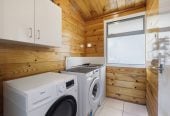 1088m2 section, 3 beds 1 bath house with carport, wooden walls and ceilings wrap around the interconnected lounge, dining area and kitchen. and Outside, the multi-level timber deck, 37A Youngs Road, Papakura, Auckland