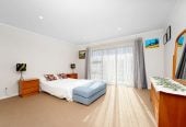 The owners are ready for a bigger home. 130m2 Brick and tile 2 beds 1 bath home with garage, 2/219 Edmonton Road, Te Atatu South, Auckland