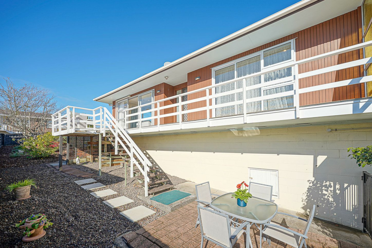The owners are ready for a bigger home. 130m2 Brick and tile 2 beds 1 bath home with garage, 2/219 Edmonton Road, Te Atatu South, Auckland