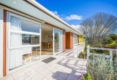 The owners are ready for a bigger home. 130m2 Brick and tile 2 beds 1 bath home with garage, 2/219 Edmonton Road, Te Atatu South, Auckland