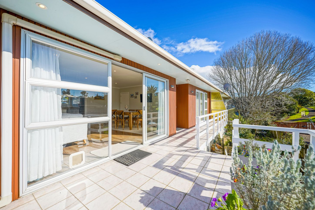 The owners are ready for a bigger home. 130m2 Brick and tile 2 beds 1 bath home with garage, 2/219 Edmonton Road, Te Atatu South, Auckland