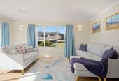 The owners are ready for a bigger home. 130m2 Brick and tile 2 beds 1 bath home with garage, 2/219 Edmonton Road, Te Atatu South, Auckland