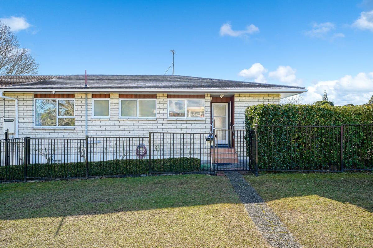 The owners are ready for a bigger home. 130m2 Brick and tile 2 beds 1 bath home with garage, 2/219 Edmonton Road, Te Atatu South, Auckland