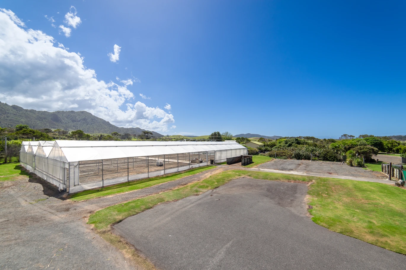 43000m2 section by the sea, LIFESTYLE, INCOME & OPPORTUNITY, Highlights include an impressive four-bay greenhouse spanning approximately 1,800sqm, a 1.2 million litre lined water reservoir, substantial workshop and packing facilities, a walk-in chiller, generous office space, and established propagation areas. a 3 beds bungalow surrounded by established cottage, A separate garage with loft accommodation, 100 Robinson Road Whangarei Heads, Whangarei District